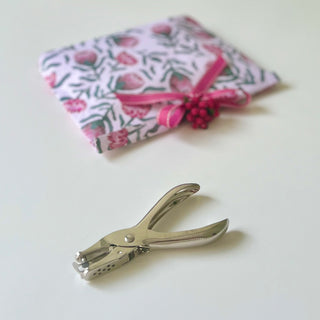 Single hole punch